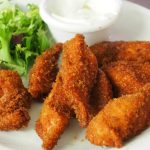 delicious-crispy-fried-chicken-tenders-served-with-a-fresh-green-salad-and-dipping-sauce